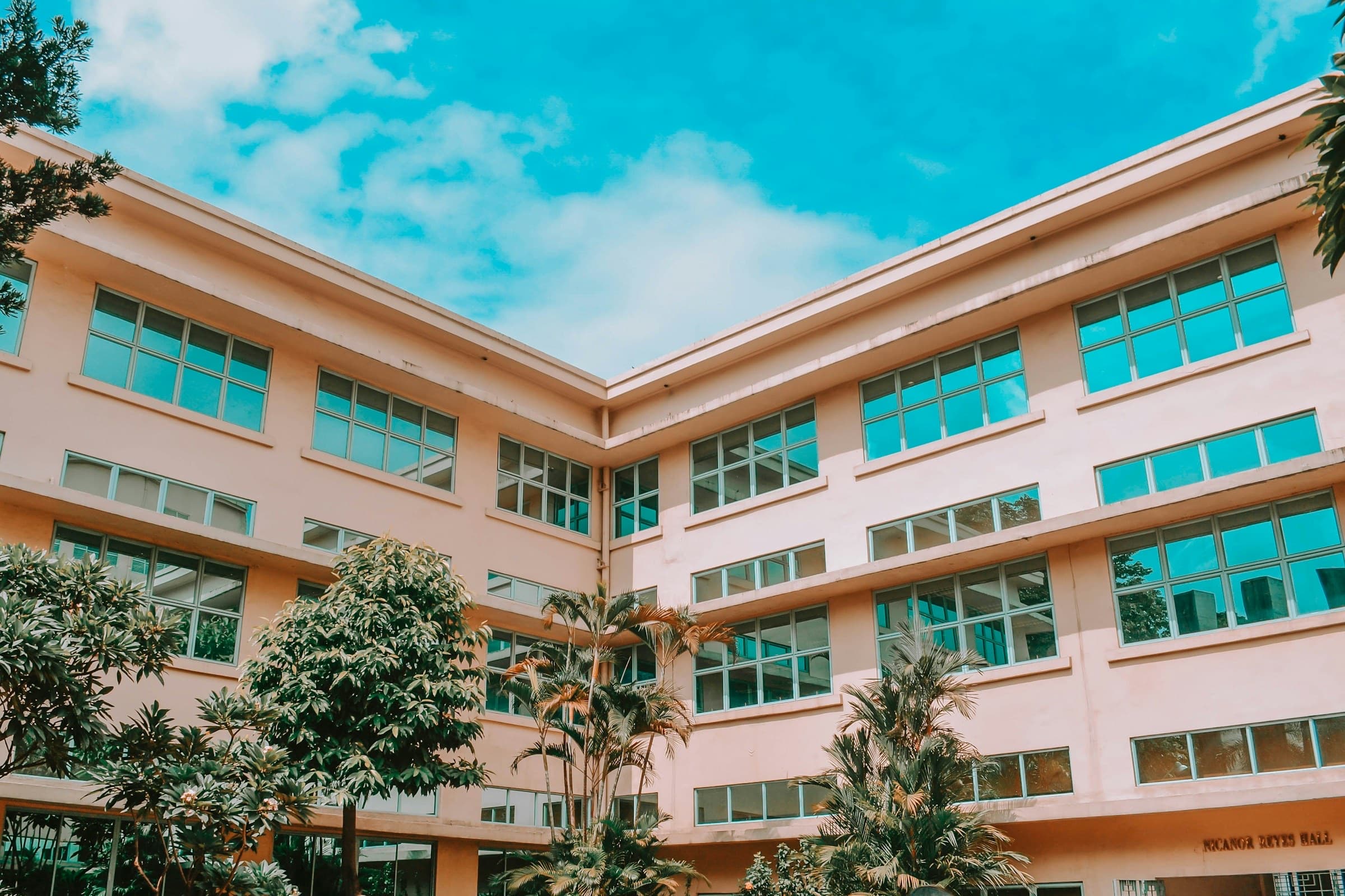 School campus building with rows of classroom windows